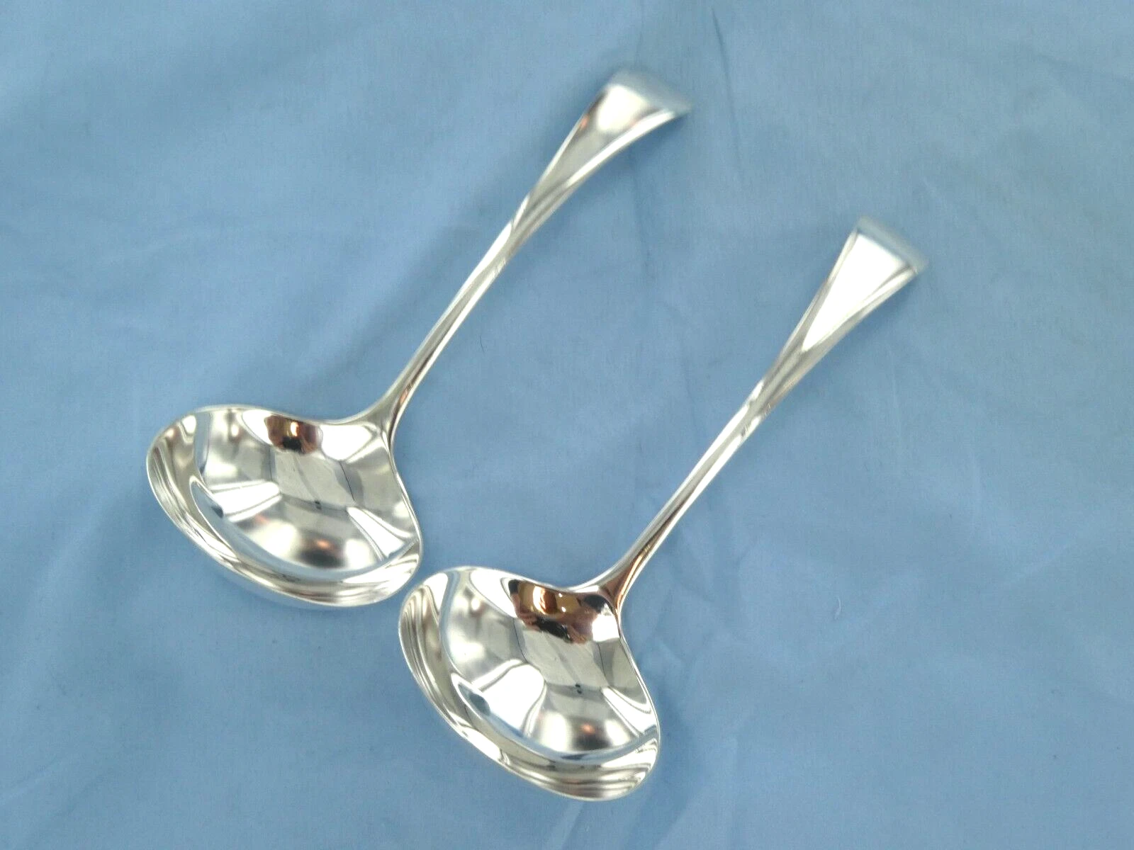 AN ANTIQUE PAIR OF STERLING SILVER OLD ENGLISH SAUCE LADLES. SHEFFIELD 1907.
Opens in a new window o