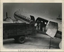 1956 Press Photo Airnews Inc. Plane being loaded at Airport - sax30958