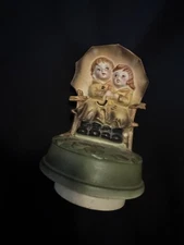 VINTAGE HUMMEL STYLE SANKYO MUSIC BOX BOY AND GIRL UNDER UMBRELLA