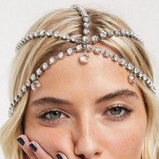 Luxurious rhinestone headwear and hair chain sparkle at the bride's party