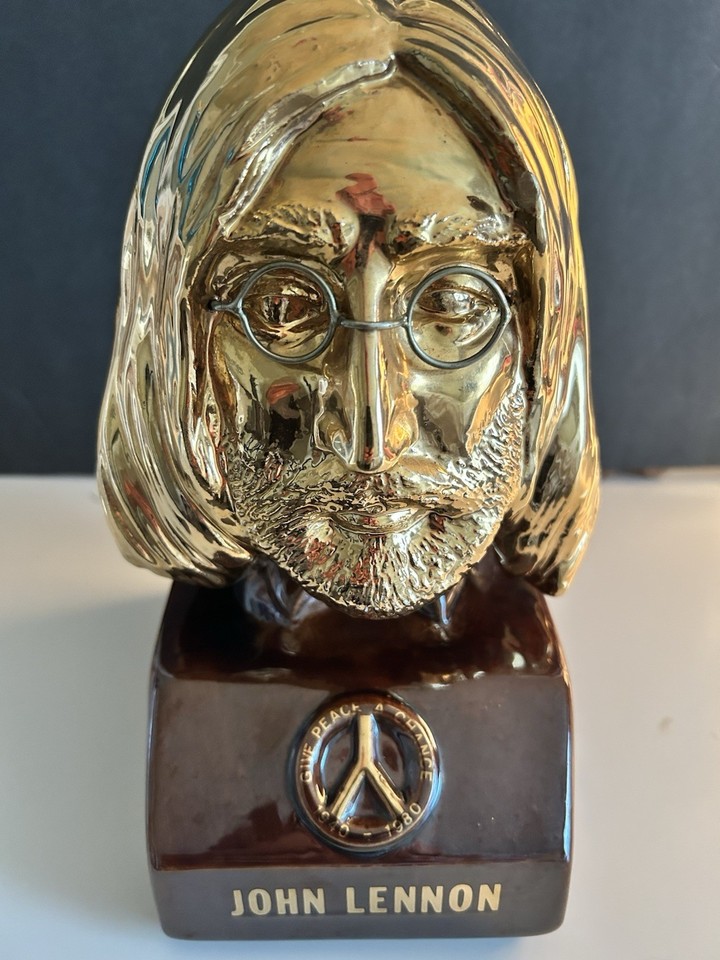 A gold bust whiskey decanter of John Lennon is gloriously weird, undeniably collectible, and will live rent-free in any Beatles fan's bar cabinet.