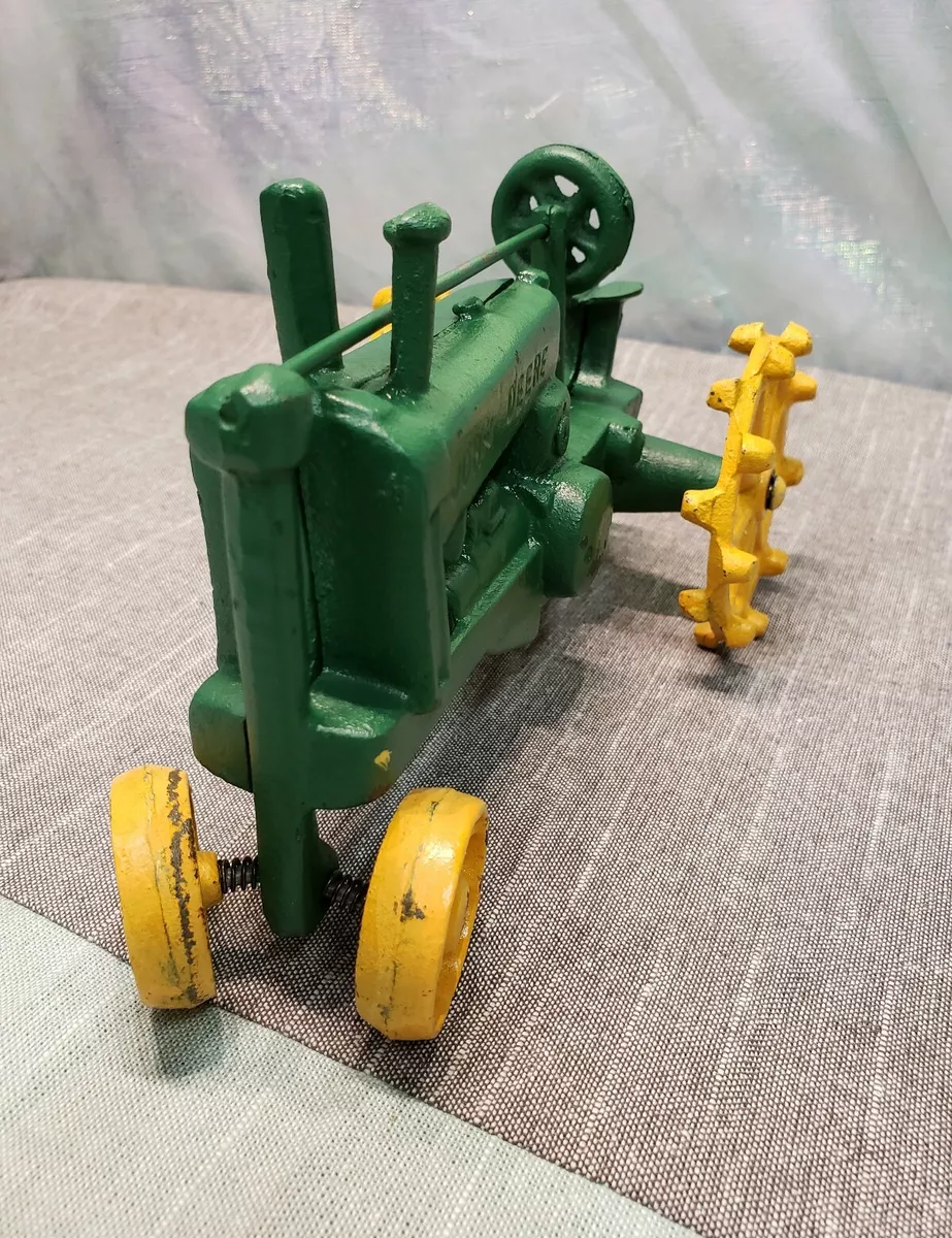 John deere cast hotsell iron toy tractor