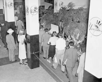 Some of the thousands who paid their last respects pass the casket .. Old Photo