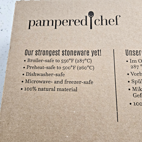 Brown box with white text from Pampered Chef 100251, “Our strongest stoneware yet!” and product features.