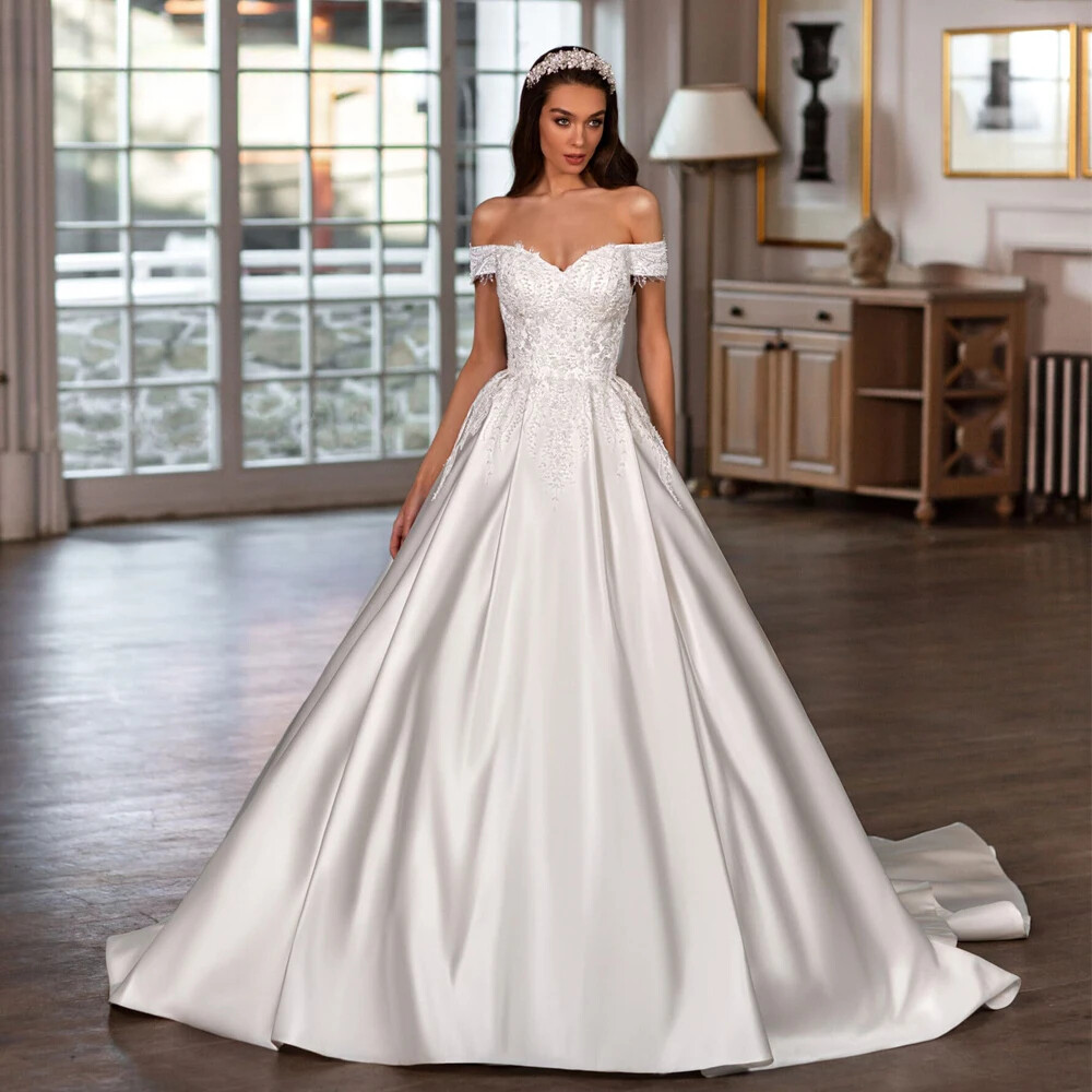off the shoulder wedding dress backless ball gowns One-Shoulder Off-the-Shoulder Ziberline Wedding Dress with Bow Back Detail