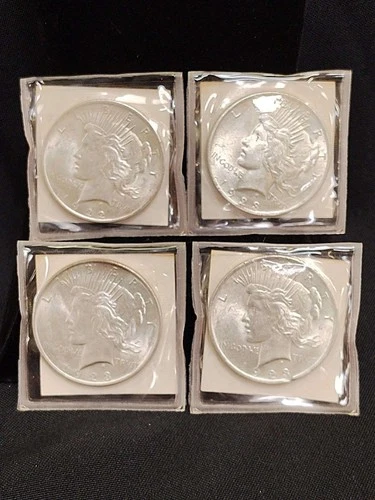 Lot of 4 BU Silver Peace Dollars including 1922 and 1923 x3