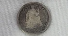 1854 Liberty Seated Half Dime in Poor Condition and is slightly bent