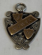 Antique silver and 9ct gold watch fob medal