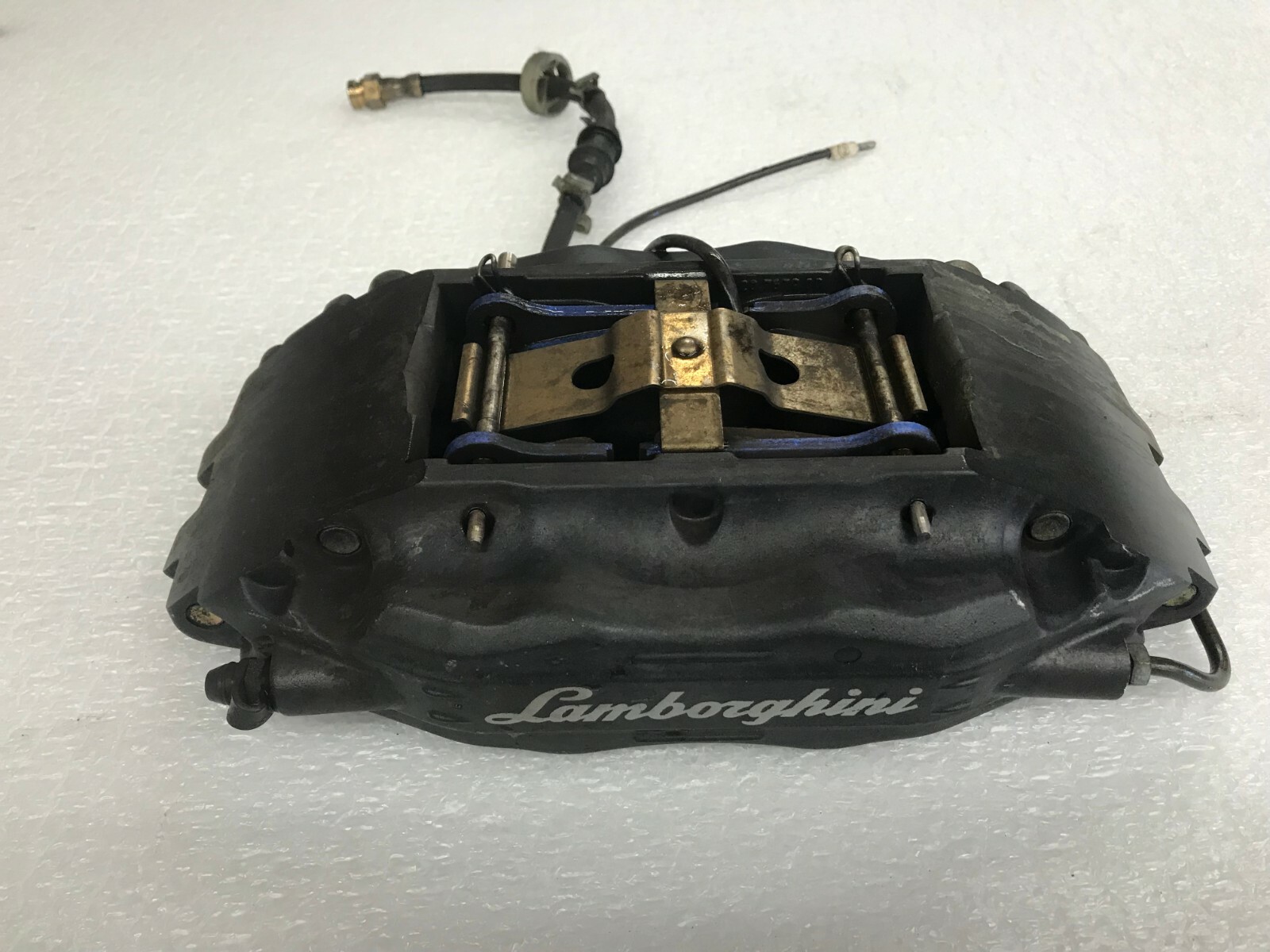 LAMBORGHINI MURCIELAGO FRONT LEFT DRIVER LH BRAKE CALIPER W/ LOGO OEM 0031008999