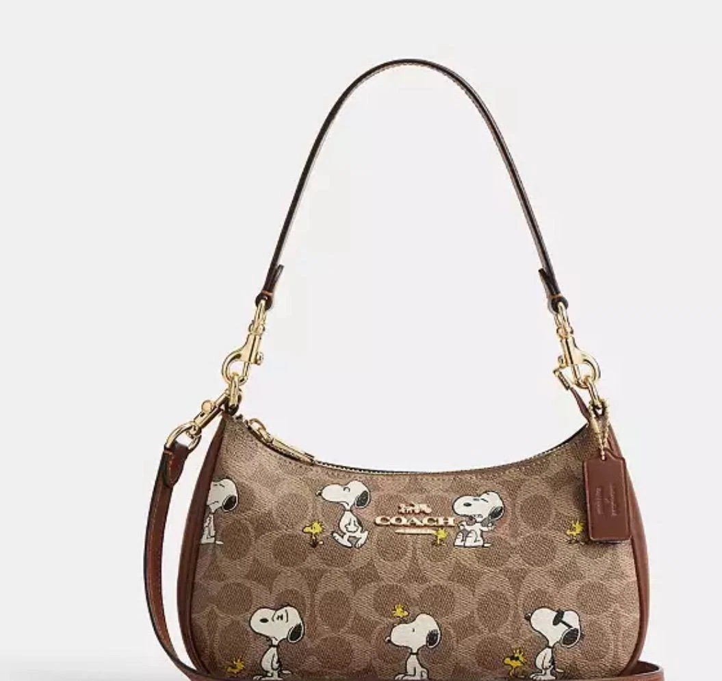 Borsa a tracolla Coach x PEANUTS Teri marrone marrone chiaro stampa snoopy firma tela CBJ88