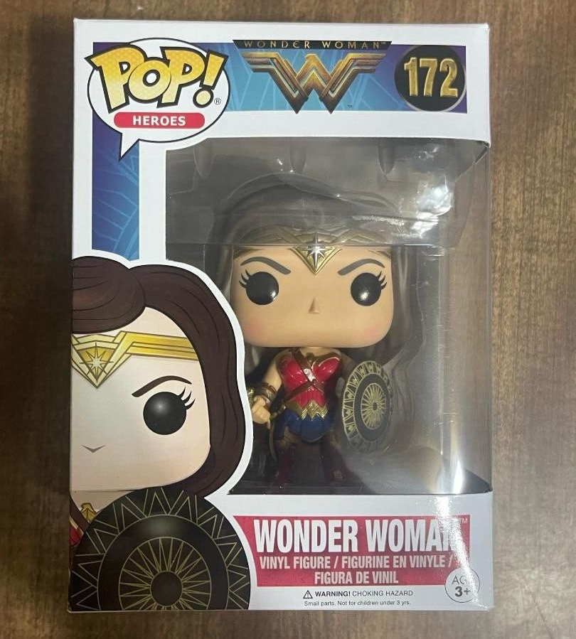 Three Wonder Woman Pop Vinyl Figures: #86, #86 WALMART VARIANT, #172, in red/gold armor with accessories.