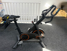 UREVO Upright Exercise Bike with LCD Display, Adjustable Seat, Black/Orange