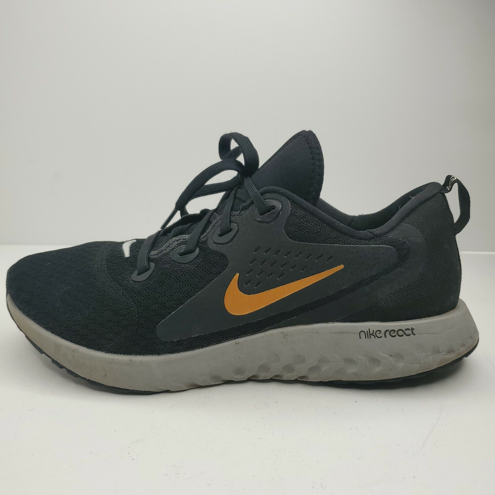 nike legend react black gold