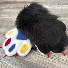 The animal's fluffy black paws were made by hand.SALE