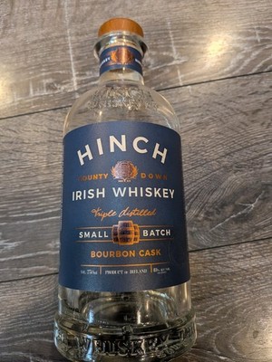 Empty Clear Corked Bottle of Hinch Triple Distilled Small Batch Irish Whiskey
