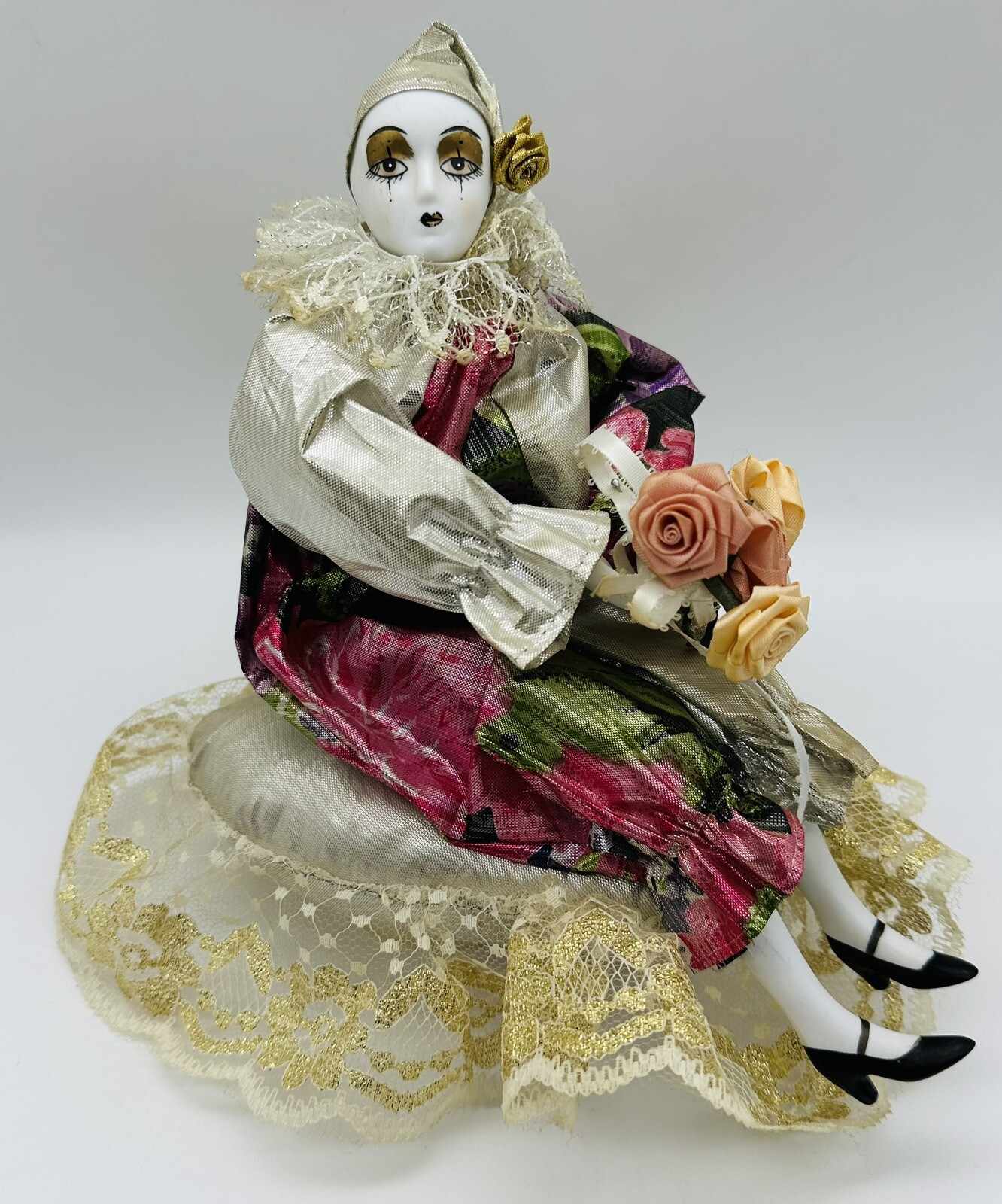 Old Musical Rotating Porcelain Doll Harlequin Clown Girl on a Brocade Pillow