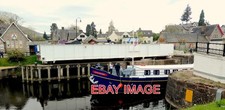 PHOTO  THE CANAL CRUISER 'SCOTTISH HIGHLANDER' IS JUST LEAVING THE BOTTOM LOCK A