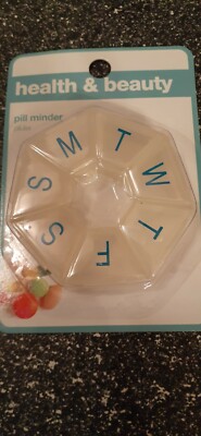 Pill/medication reminder.  7 day. Clear. Round. Travel and every day use.