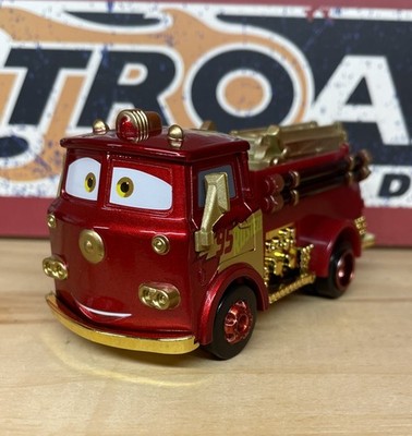 Disney Pixar Cars Gold & Red Factory Custom Rusteze Fire Truck Loose