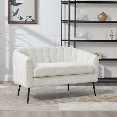 Two-seater sofa with metal legs, grooved design, and removable cushions