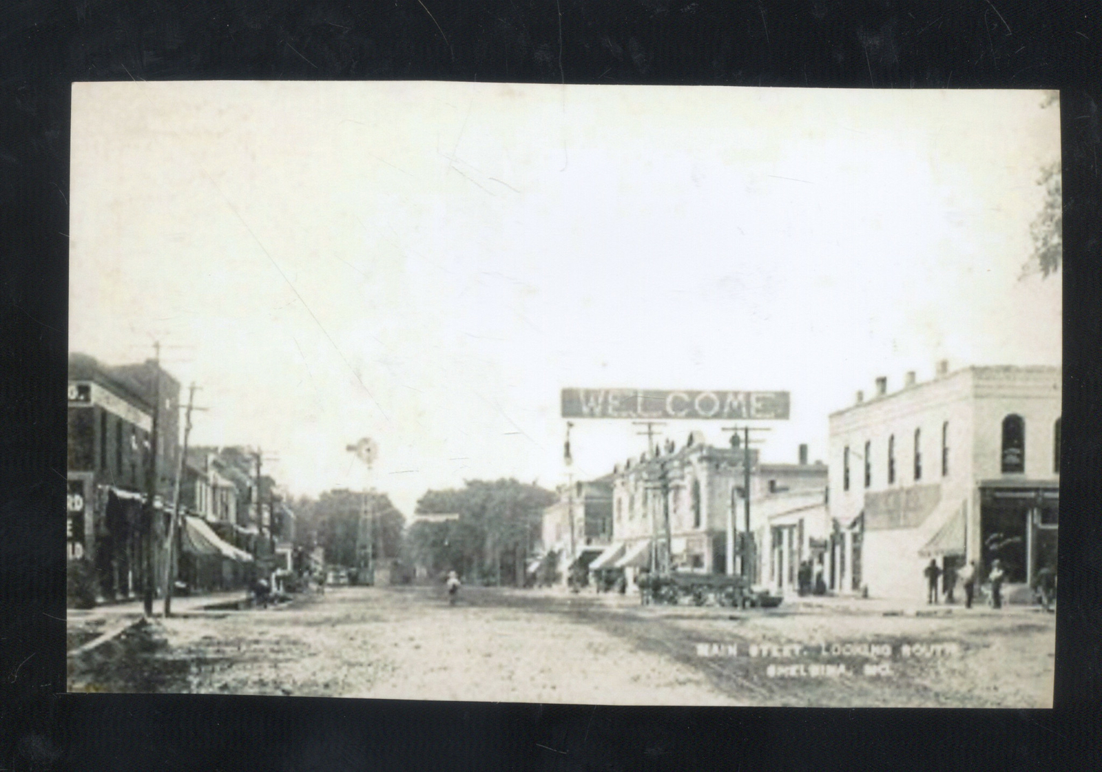REAL PHOTO SHELBINA MISSOURI DOWNTOWN STREET SCENE STORES POSTCARD COPY