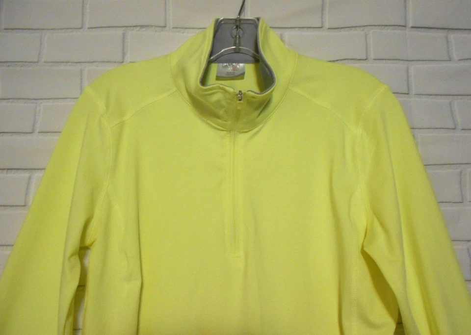 Camiseta deportiva de manga larga con reflector Henley amarillo mediano Danskin para mujer  Foto 2 de 4