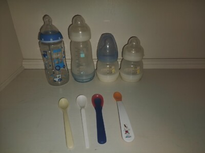 4 Babyflaschen + 4 Babylöffel -Marke NUK und MAM -gute Zustand 