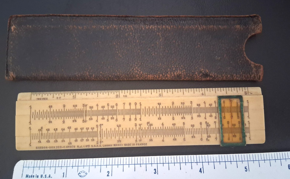 A French boxwood slide rule by Guédon — French boxwood instruments are rare outside Europe and the warm wood grain makes this as much art object as calculating tool.