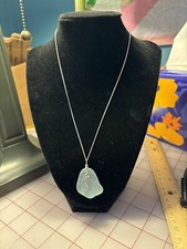 Sea glass pendant with sea horse charm on silver tone chain