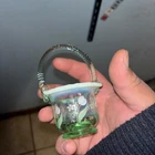 Fenton green opalescent mini basket with a hand-painted floral design