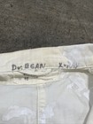 White vintage painters smock work wear with blue ink size 40, with visible collar tag reading “Dyer & Gray.”