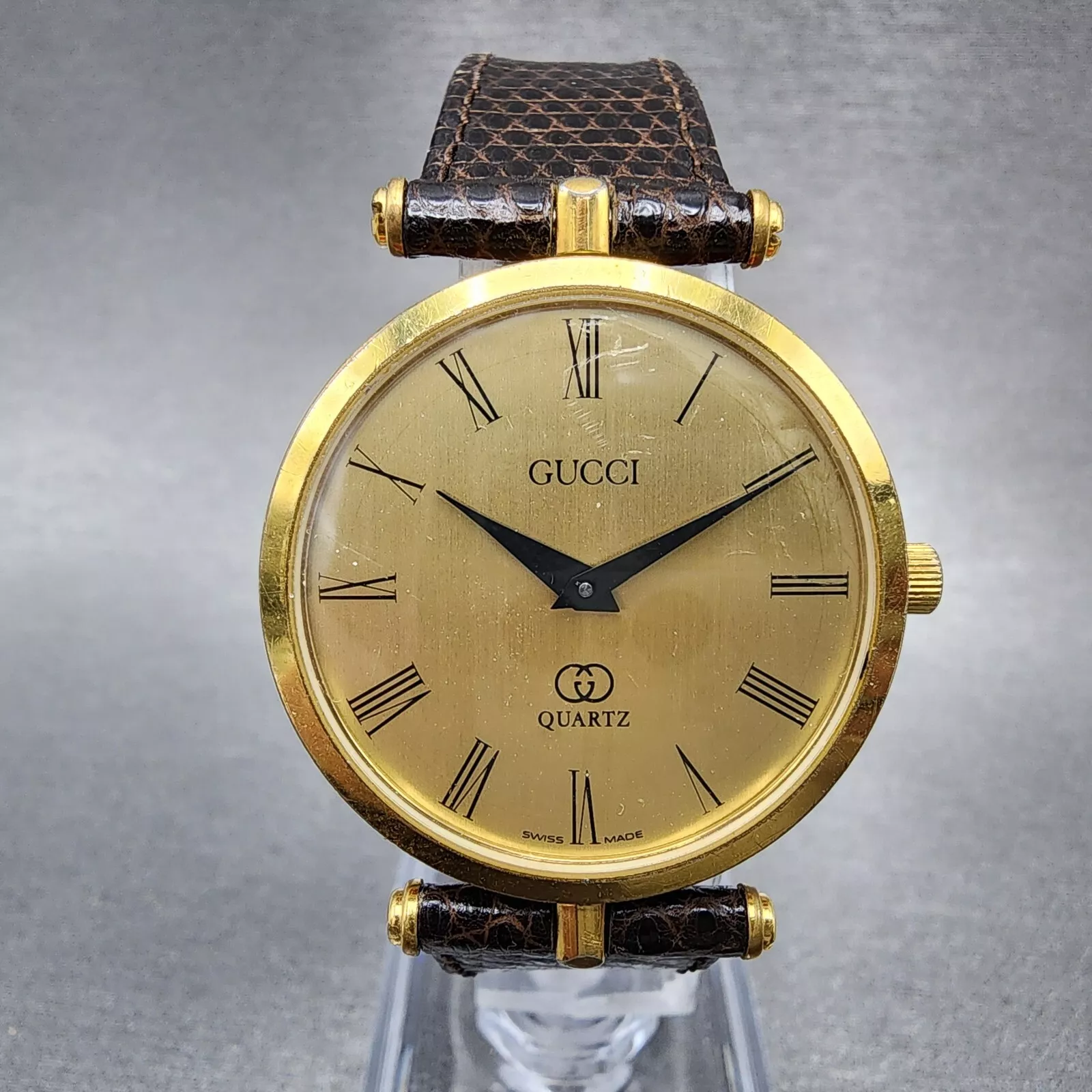 Montre Gucci 2000M homme 30 mm cadran champagne plaqué or bracelet cuir rond NewBa11