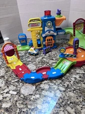 V-Tech Go! Go! Smart Wheels Police Station Playset With Police Car Working