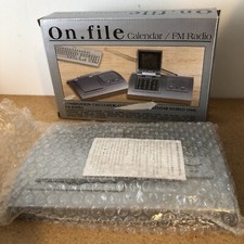 ON. FILE CALENDAR FM RADIO COMBINATION WORLD CLOCK RADIO INSTRUCTIONS NIB