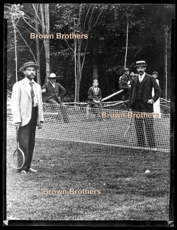 1900s Dapper Gents in Jackets & Boaters Play Tennis on the Lawn Film Negative