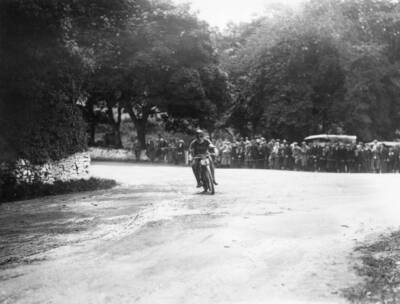 Cox 275 Forward rounds Ballacraine Corner during Isle Man Junior T - 1912 Photo