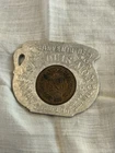 An Antique Lucke Token Featuring An Indian Head 1907 Penny In An Aluminum Fra