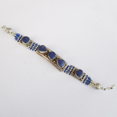 The bracelet features Lazuli Beads, a hook closure, and measures 7'' in length