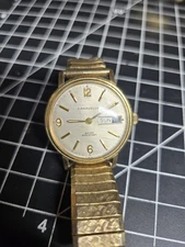 vtg caravelle mens day date watch gold tone mechanical bulova
