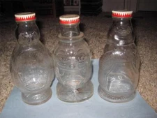 VINTAGE SNOW CREST GLASS SEAL, PENGUIN, CLOWN (3 BANKS) BOTTLE BANK LOT F-RATED