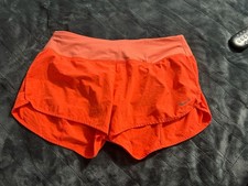 Nike Women's Dri-FIT Running Shorts with Rear Zipper Pocket Neon Orange
