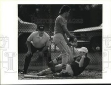 1992 Press Photo Softball player Josh James slides into home ahead of throw