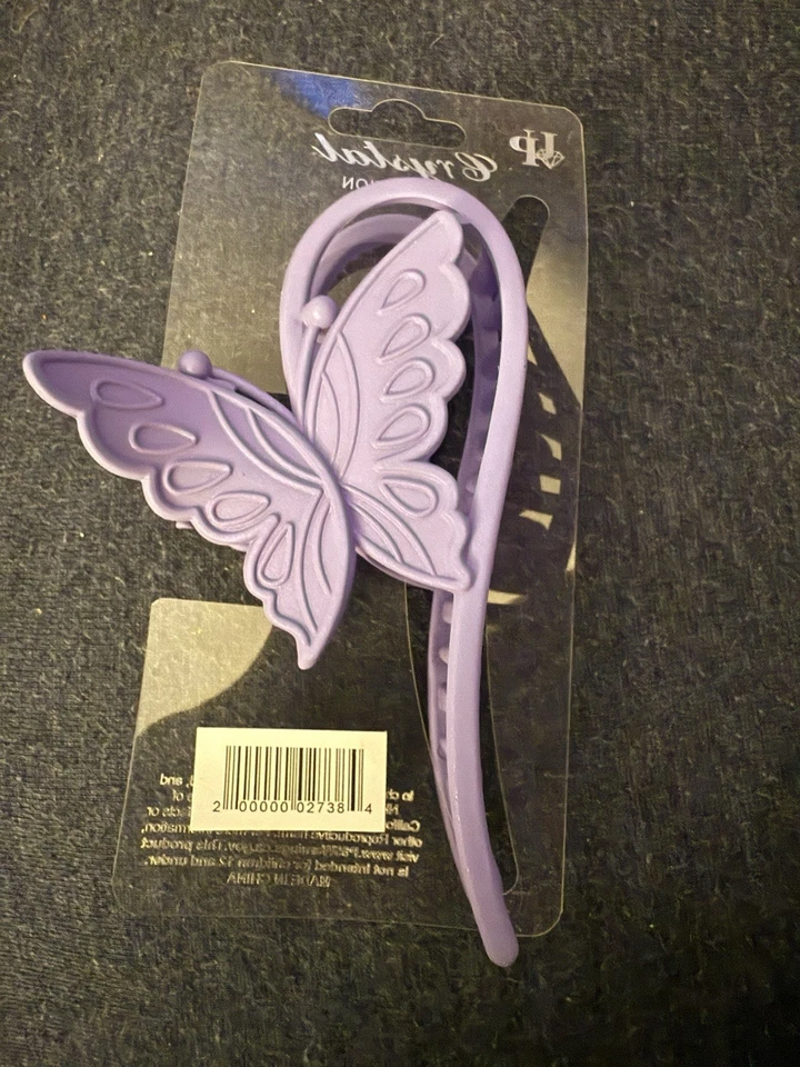 Garra de pelo de mariposa púrpura por cristal Foto 4 de 4