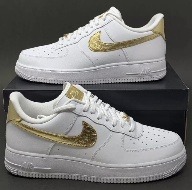 white nikes with gold swoosh