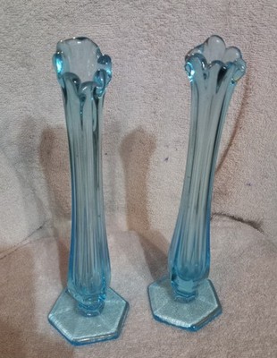 These are a pair of vintage blue stretch glass vases,