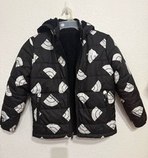 The North Face ReveThe North Face Reversible Puffer Jacket Black White Logo Kids