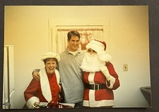 FOUND VINTAGE PHOTO PICTURE Man laughing and hugging Santa and Mrs. Claus