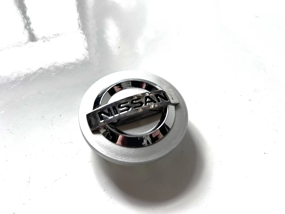 Tapa central llanta Nissan Rogue Leaf X-Trail Sentra Máxima 2002-2019 2-1/8" Foto 2 de 4