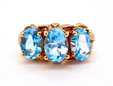 14K YELLOW GOLD OVAL 3 STONE BLUE TOPAZ RING