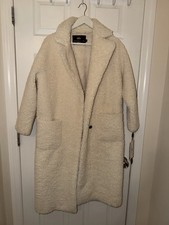 Fluffy long coat with buttons - one-tone